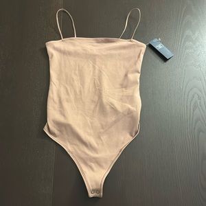 Tan bodysuit with spaghetti straps. Abercrombie & Fitch
